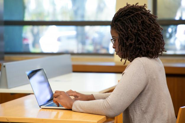 Focused-woman-student-working-computer