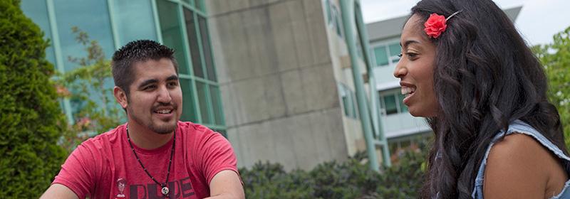 VIU students sitting on grass at Nanaimo Campus